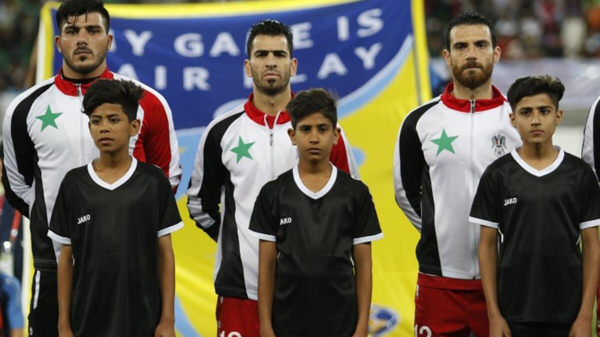 Syrian players look on prior to the international friendly football game Qatar vs Syria at Basra Sports City stadium in the southern Iraqi city on March 24, 2018.
HAIDAR MOHAMMED ALI / AFP
