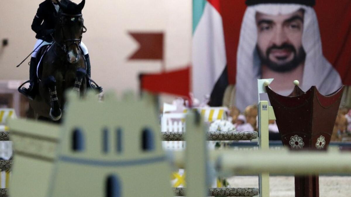 Emirati horserider Nadia Abdul Aziz Taryam competes during the Sheikh Sultan Bin Zayed Al Nahyan Showjumping Championship in Bou Thib, south of Abu Dhabi on March 5, 2016.
KARIM SAHIB / AFP