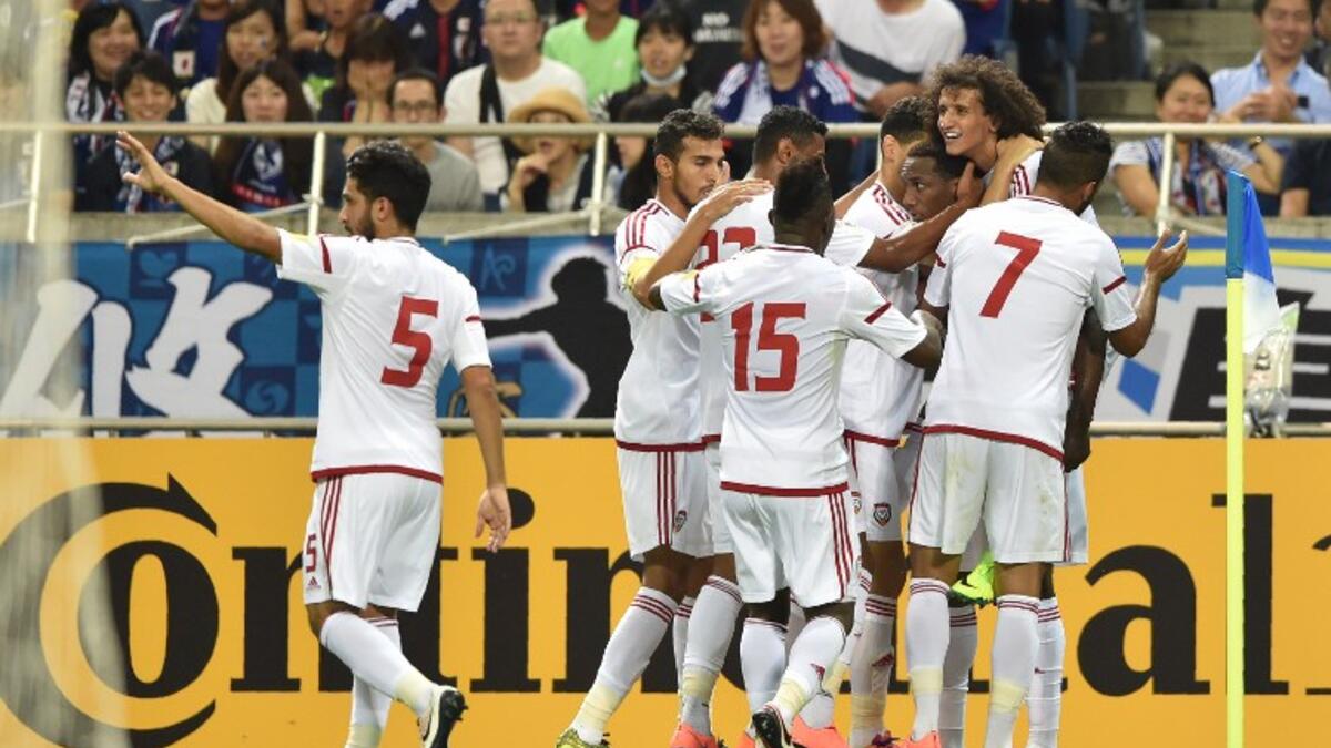 Players of United Arab Emirates (UAE) celebrate their winning goal against Japan during their football match in the final round of Asian qualifiers for the 2018 World Cup at Saitama Stadium on September 1, 2016.
KAZUHIRO NOGI / AFP