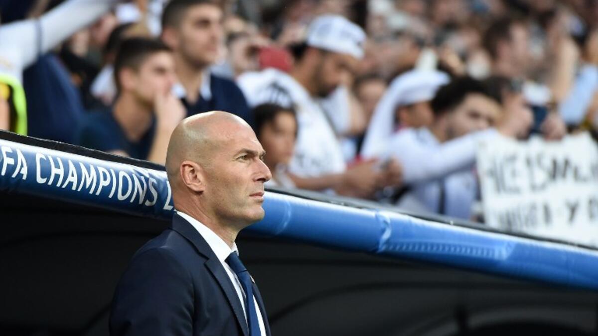 Real Madrid's French coach Zinedine Zidane waits prior the UEFA Champions League quarterfinal second leg football match Real Madrid vs FC Bayern Munich at the Santiago Bernabeu stadium in Madrid, Spain, on April 18, 2017.
Christof STACHE / AFP