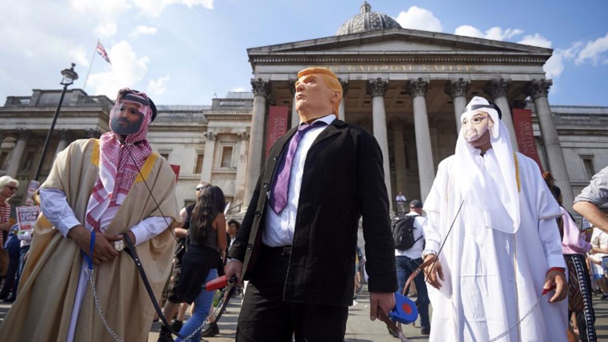 Protesters against the UK visit of US President Donald Trump gather in Trafalgar Square after taking part in a march in London on July 13, 2018.(Niklas HALLEN / AFP)
