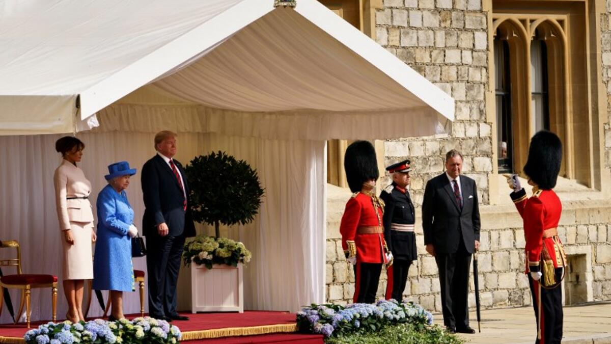 Britain's Queen Elizabeth II stands with US President Donald Trump and US First Lady Melania Trump on their arrival at Windsor Castle in Windsor, west of London, on July 13, 2018 on the second day of Trump's UK visit. (Brendan Smialowski / AFP)