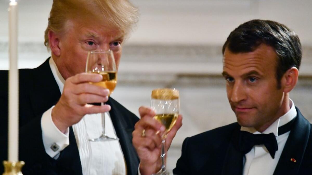 US President Donald Trump (L) and French President Emmanuel Macron (R) toast during a State Dinner in honor of Macron at the White House in Washington, DC, April 24, 2018. 
ludovic MARIN / AFP