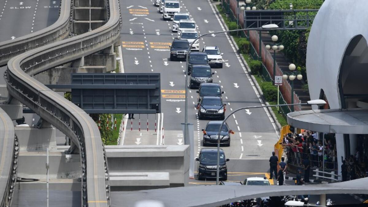 The motorcade (C) transporting North Korea's leader Kim Jong Un leaves Sentosa island after taking part the North Korea-US summit with US President Donald Trump in Singapore on June 12, 2018. (Ted ALJIBE / AFP)