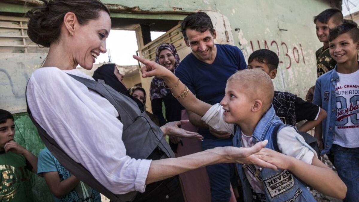 Special Envoy Angelina Jolie meeting Falak, 8, during a visit to West Mosul, on June 16, 2018. Falak has a gene disorder and PTSD. (UNHCR/AFP/Andrew McConnell)