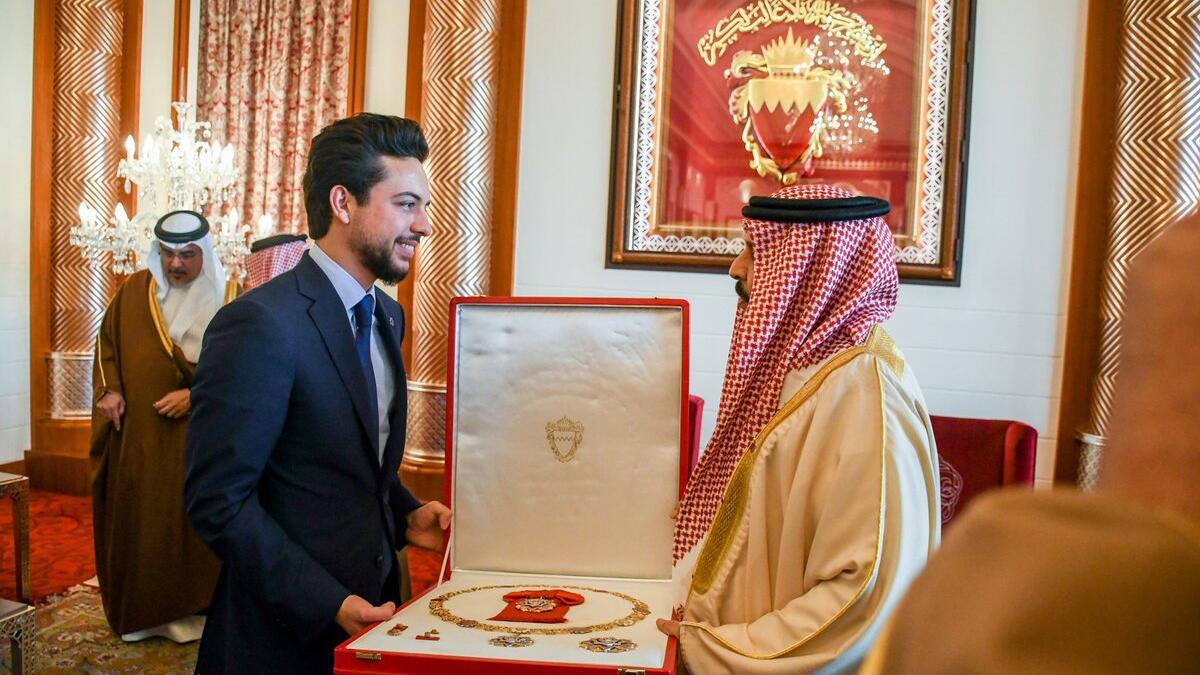 King Hamad bin Isa Al Khalifa of Bahrain bestows the King Hamad Order of the Renaissance 1st class (Wisam al Nahda) on Crown Prince Al Hussein bin Abdullah II.m(Twitter/@RHCJO)