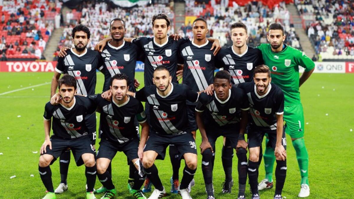 Qatar's Al-Sadd starting eleven pose for a team photo prior to the start of their AFC Champions League third round qualifying football match against UAE's Al-Jazeera club at the Mohammed Bin Zayed Stadium in Abu Dhabi on February 9, 2016.