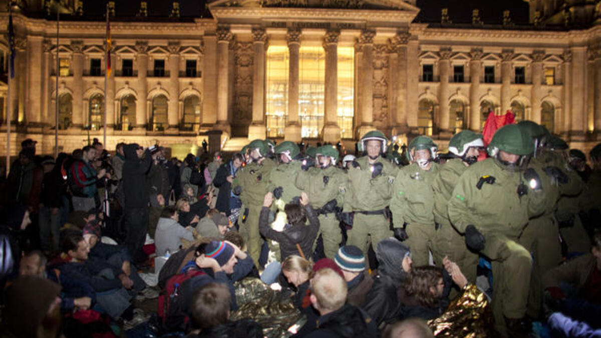 No longer a 'Wall' to occupy or tear down, Berlin keeps the peace, not wishing to give Iran another chance at a quip to 
the 'Western' police- handling of riots. Frankfurt -  the Euro-zone's financial hub - joined Europe's mainly peaceful assemblies in voicing objection to the perceived social injustice in the people- versus- banks stand-off.