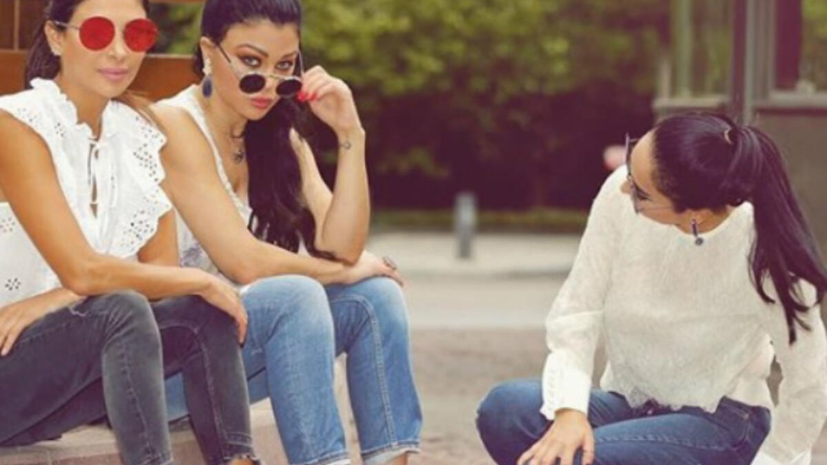 The Lebanese diva and her sisters sported casual looks with denim tight pants