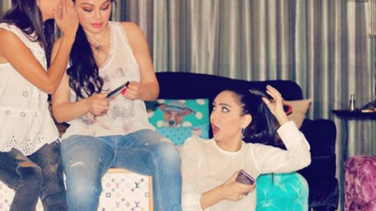 The Lebanese diva and her sisters sported casual looks with denim tight pants