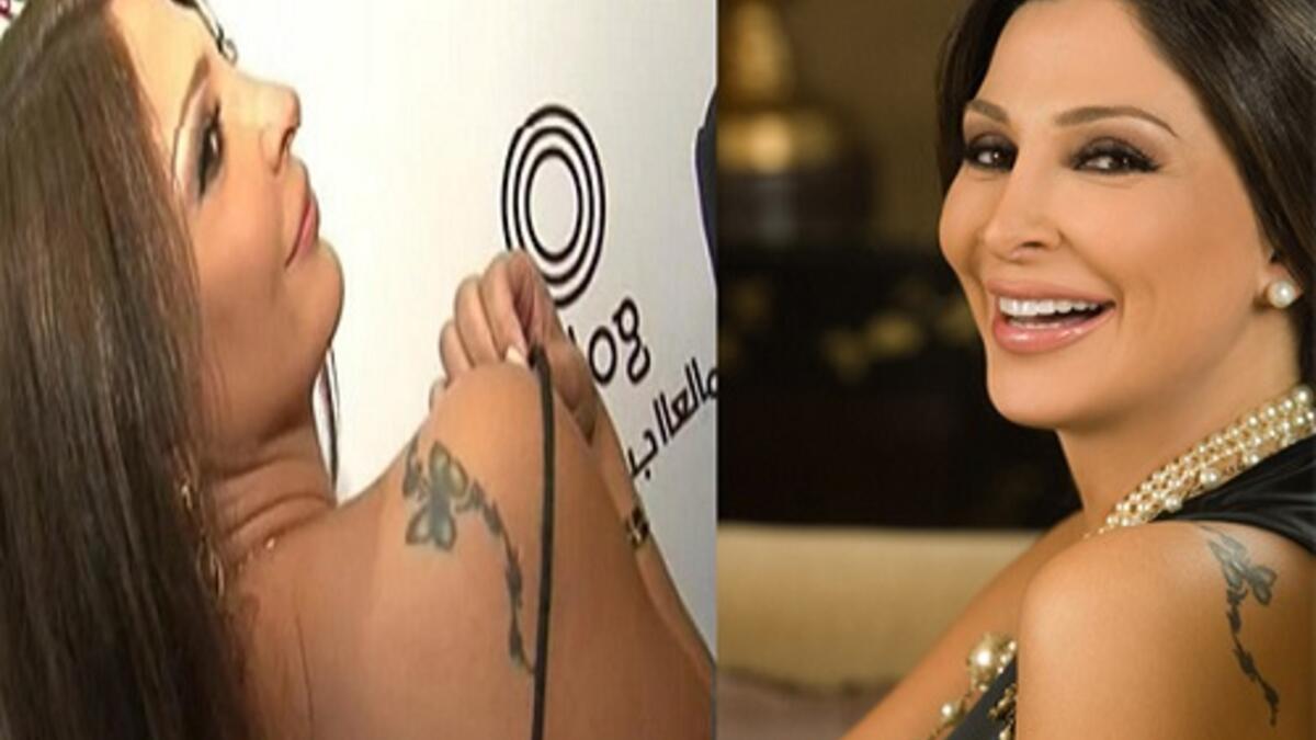 ملكة الرومانسية إليسا وشمت على كتفها تاتو على شكل فراشة.