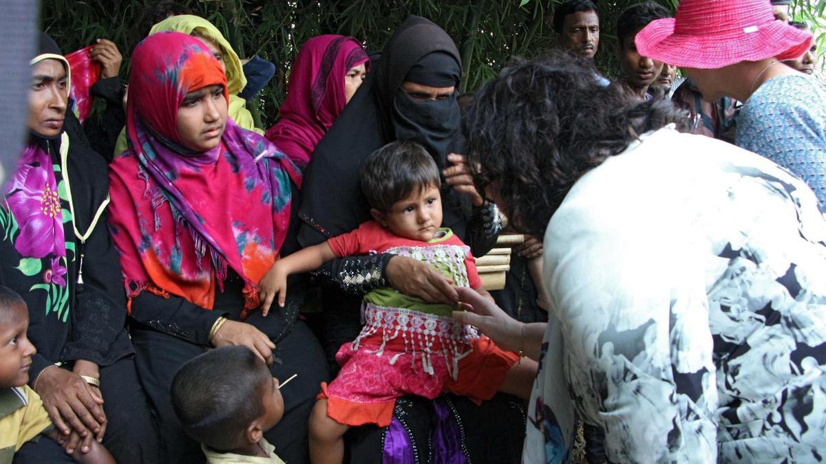 The high-level 15-member delegation of the UN Security Council talk to Rohingya refugees during their visit to Tombru in the Bangladeshi district of Bandarban on April 29, 2018. AFP