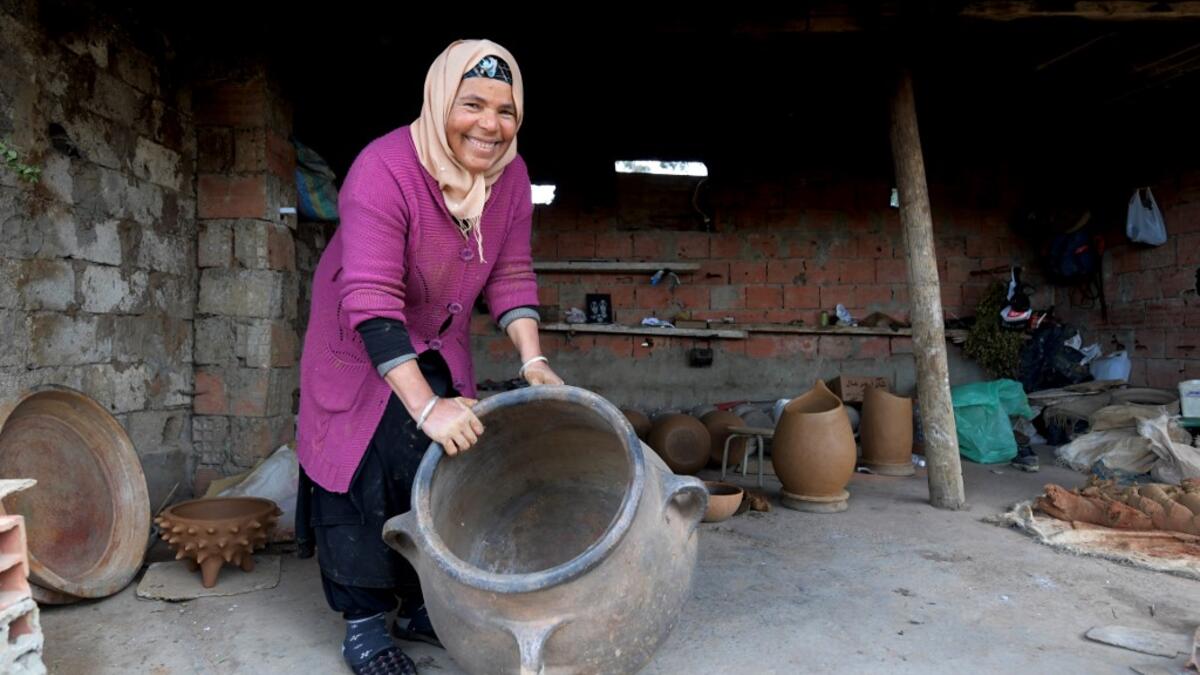 Sabiha Ayari, a Tunisian potter in her fifties, works in the village of Sejnane in the northern Tunisian province of Bizerte, about 120 kilometres (75 miles) west of the capital Tunis.  FETHI BELAID / AFP