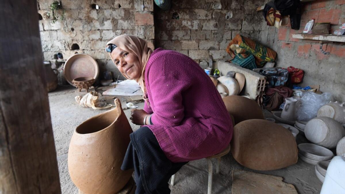 Sabiha Ayari, a Tunisian potter in her fifties, works in the village of Sejnane in the northern Tunisian province of Bizerte, about 120 kilometres (75 miles) west of the capital Tunis.  FETHI BELAID / AFP