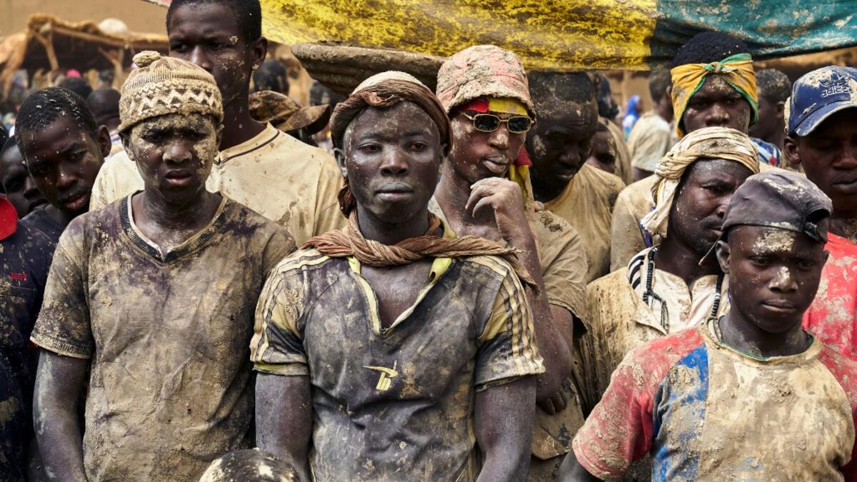 People take part in the annual rendering of the Great Mosque of Djenne in central Mali  MICHELE CATTANI / AFP