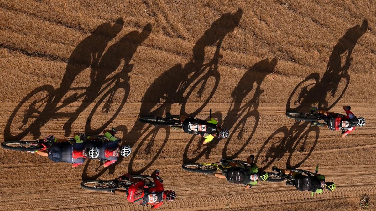 Competitors ride their bikes during Stage 4 of the 14th edition of Titan Desert 2019 mountain biking race between Merzouga and M’ssici, in Morocco, on May 1, 2019.  FRANCK FIFE / AFP