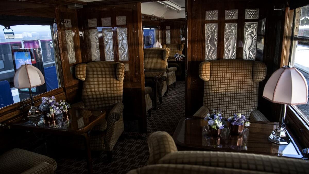 This picture taken on May 13, 2019 shows the interior of a carriage in a restored carriage of an Orient Express train displayed at the Gare de l'Est train station in Paris.  Christophe ARCHAMBAULT / AFP