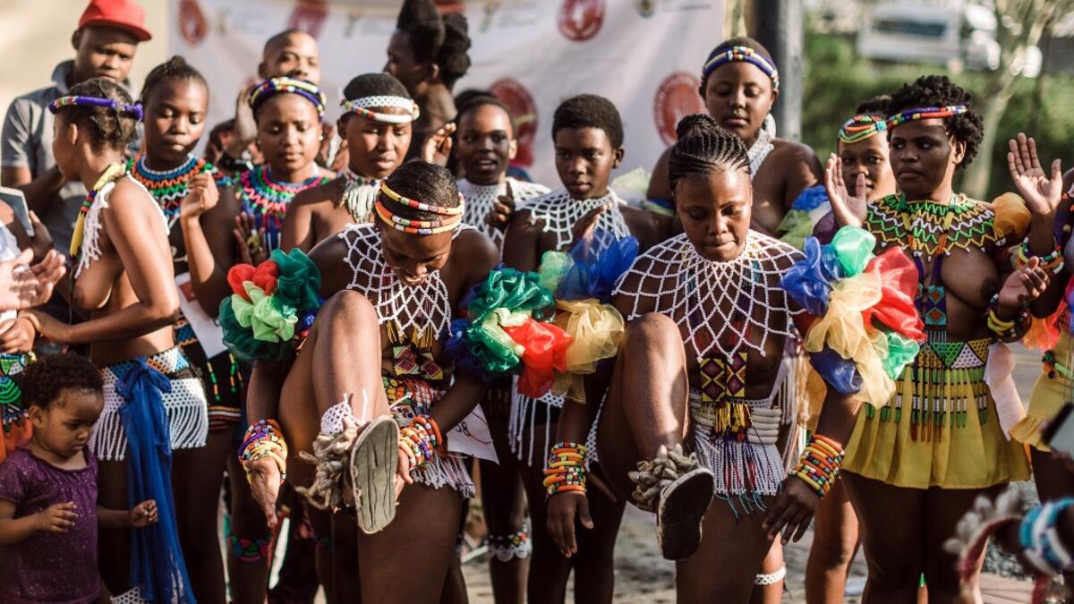 Young women dressed up in traditional attire sing and chant during an audition organised by the Indoni Culture School in the South African city of Durban. Rajesh JANTILAL / AFP