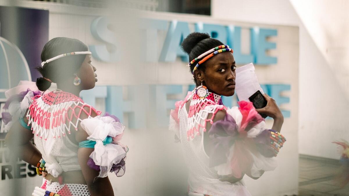 Young women dressed up in traditional attire wait for an audition organised by the Indoni Culture School in the South African city of Durban. Rajesh JANTILAL / AFP