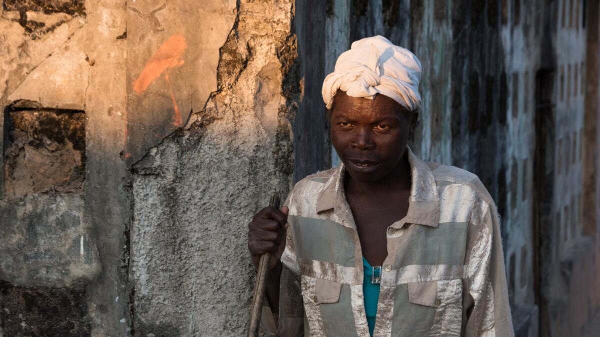 Delfina Graca, part of a group of homeless people living in a building damaged during the Angolan civil war RODGER BOSCH / AFP