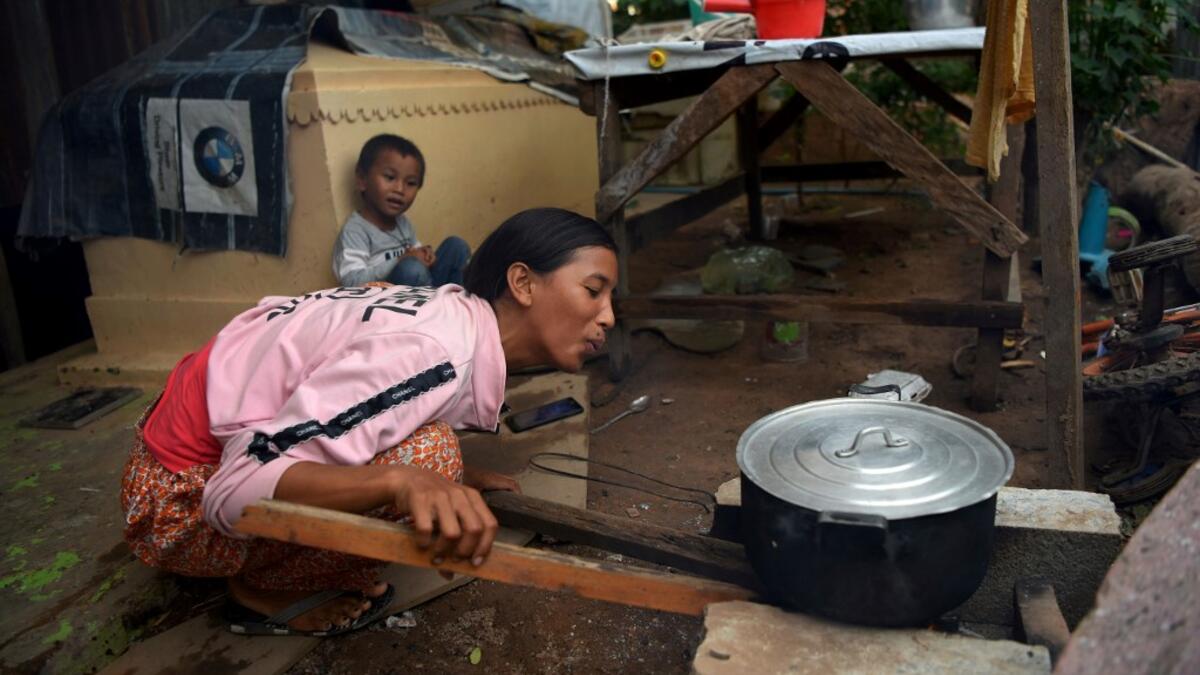 Graveyards may traditionally be the eternal resting place for the dead, but one cemetery in Phnom Penh is increasingly becoming a place to stay for the living as land disputes plague the nation’s poor.  TANG CHHIN Sothy / AFP