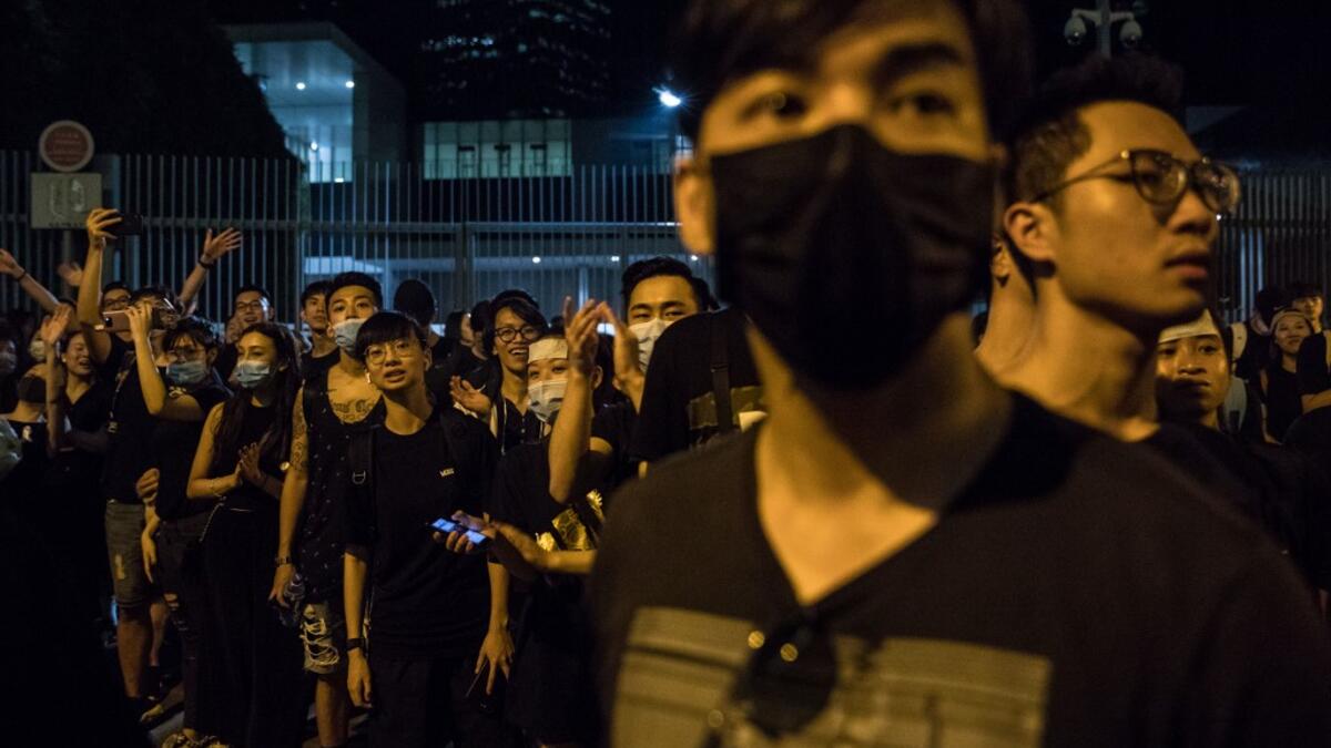 Protesters gather outside the government headquarters after a rally against a controversial extradition law proposal in Hong Kong  DALE DE LA REY / AFP