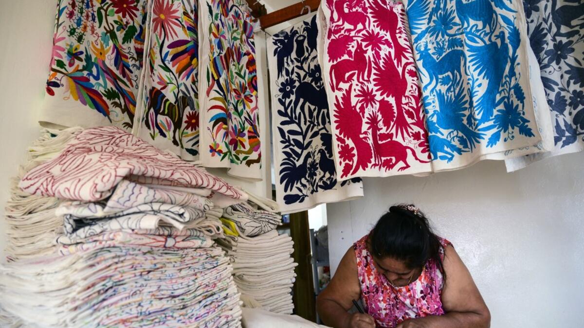 Mexican artisan Glafira Candelaria Jose, of the Otomi ethnic group, works in one of her designs at her workshop in San Nicolas village, in Tenango de Doria, Hidalgo state, Mexico.  Pedro PARDO / AFP