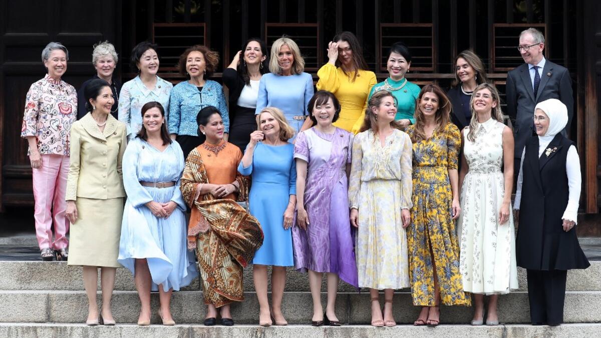 Japan's Prime Minister Shinzo Abe's wife Akie Abe (front C) poses with partners of the G20 leaders for a family photo during the G20 partners' programme at Tofuku-ji Temple in Kyoto on June 28, 2019.  DU Xiaoyi / POOL / AFP