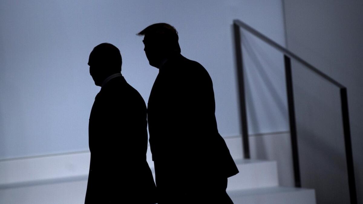 Russia's President Vladimir Putin (L) and US President Donald Trump arrive for a group photo at the G20 Summit in Osaka on June 28, 2019.  Brendan Smialowski / AFP