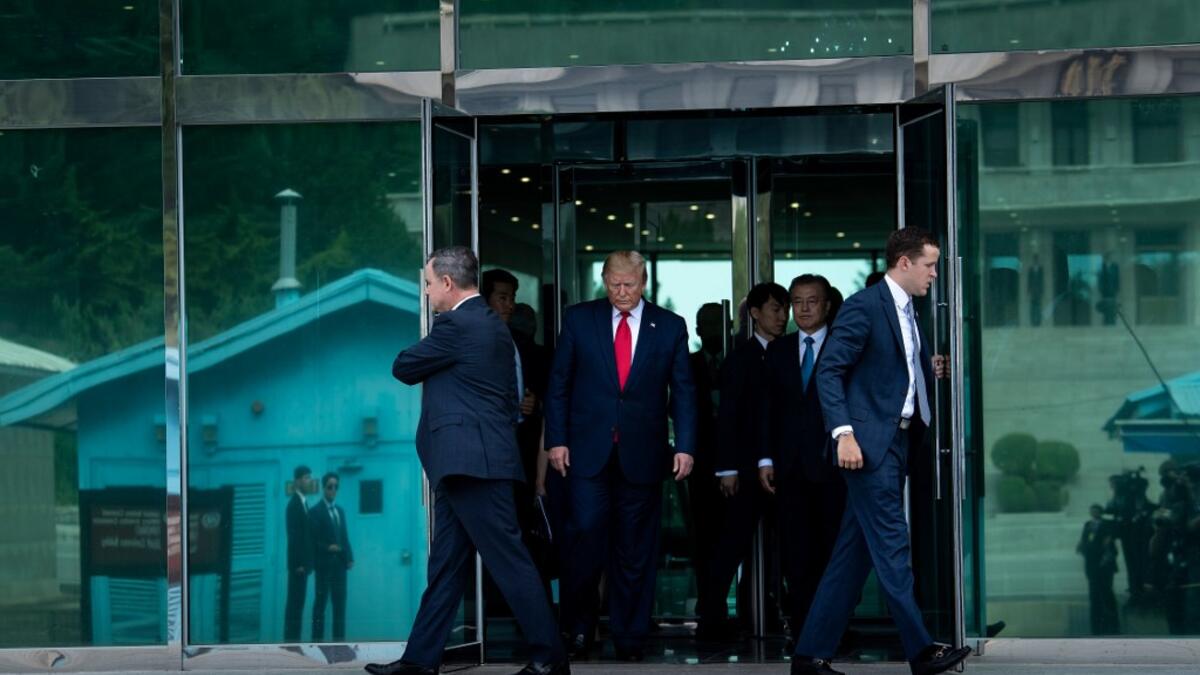 US President Donald Trump leaves Freedom House before walking to the line of demarcation to meet North Korea's leader Kim Jong-un in the Demilitarized Zone(DMZ) on June 30, 2019, in Panmunjom, Korea.  Brendan Smialowski / AFP