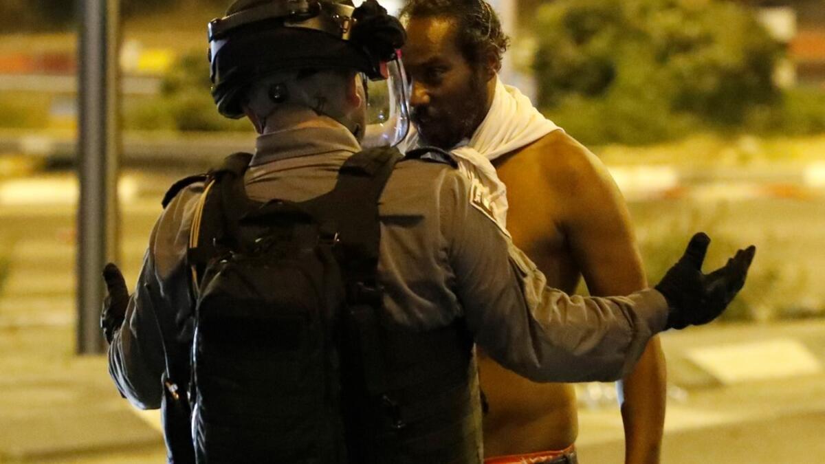 Crowds of Ethiopian Israelis battled police and blocked highways on at least 15 junctions across the country, with 47 officers wounded and 60 demonstrators detained, according to a police statement.  JACK GUEZ / AFP