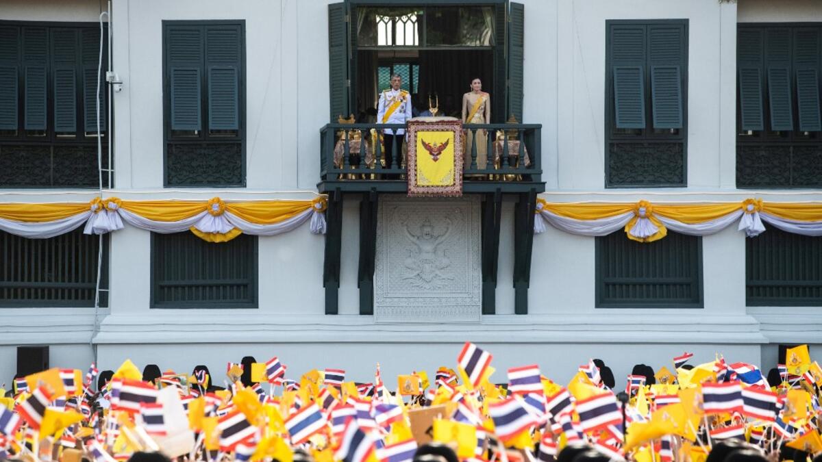 Thailand's King Maha Vajiralongkorn and Queen Suthida appear on the balcony of Suddhaisavarya Prasad Hall of the Grand Palace as they grant a public audience on the final day of his royal coronation in Bangkok on May 6, 2019.  Jewel SAMAD / AFP