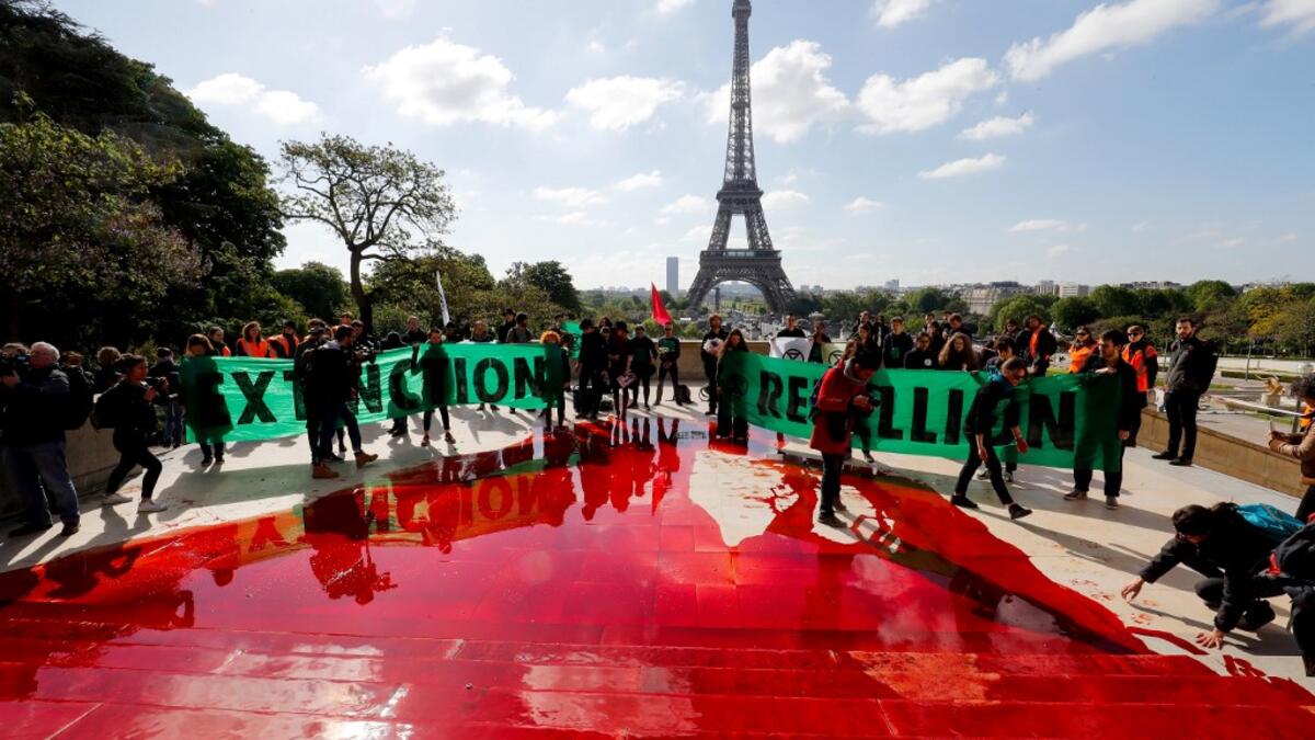Extinction Rebellion (XR) is an international movement that uses non-violent civil disobedience to achieve radical change in order to minimise the risk of human extinction and ecological collapse.  FRANCOIS GUILLOT / AFP