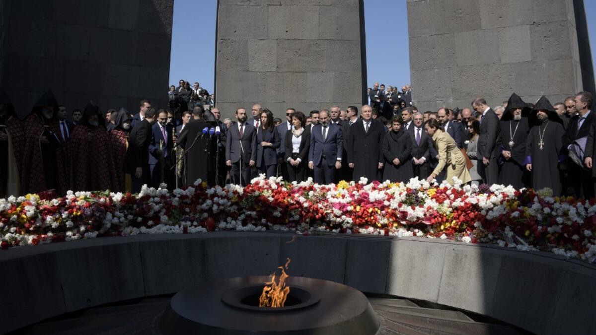 Armenian President Armen Sarkisian, Prime Minister Nikol Pashinyan, Catholicos Garegin II, the head of the Armenian Apostolic Church, and other officials attend a ceremony commemorating the 104th anniversary of the massacre of 1.5 million of Armenians by Ottoman forces in 1915. KAREN MINASYAN / AFP