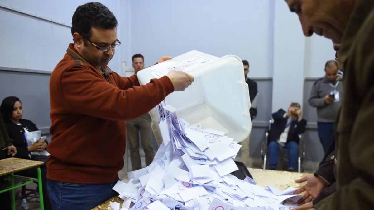 Egyptian officials count the ballots at a polling station in a school of the village of Shebin El Kom in the northern Nile delta province of Menoufia, on April 22, 2019, after the third day of a referendum on constitutional amendments. MOHAMED EL-SHAHED / AFP