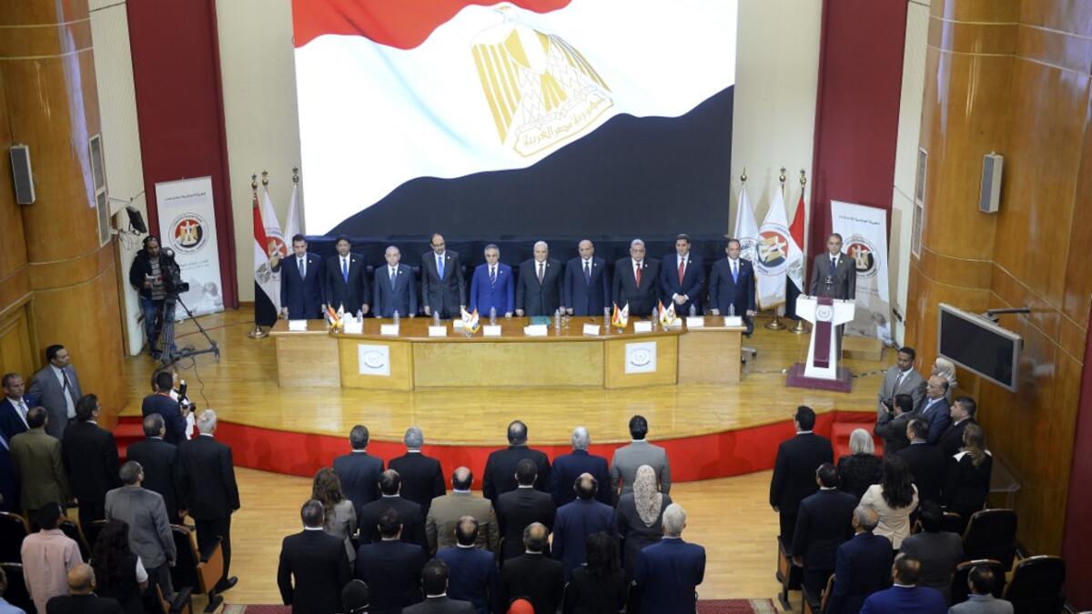 Chief of the National Elections Commission (NEC) Lashin Ibrahim (C) speaks during a press conference in the Egyptian capital Cairo on April 23, 2019 to announce the result of the referendum extending the rule of President Abdel Fattah al-Sisi. Egypt referendum extending Sisi rule passed with 88.83% of vote. MOHAMED EL-SHAHED / AFP