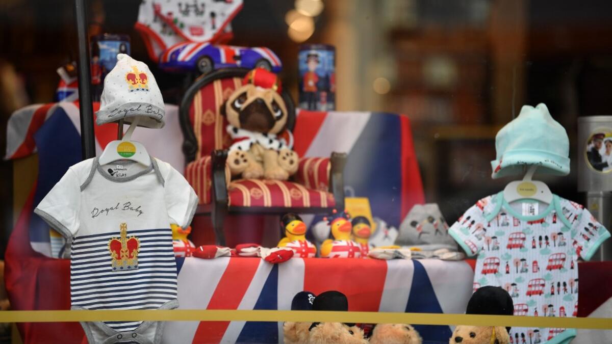 A Royal Baby outfit is pictured on display in a shop window as excitement builds in the town waiting for the birth of the child of Britain's Prince Harry and Meghan, Duke and Duchess of Sussex, on May 3, 2019.  Ben STANSALL / AFP