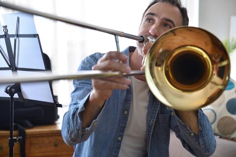 Hero Music Teacher Distracts Bear by Playing Trombone