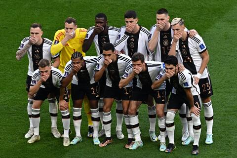 German team's mouth-covered photo split world