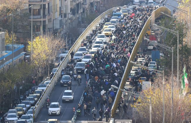 Iran president urges government to heed protesters’ demands after rial hits historic low